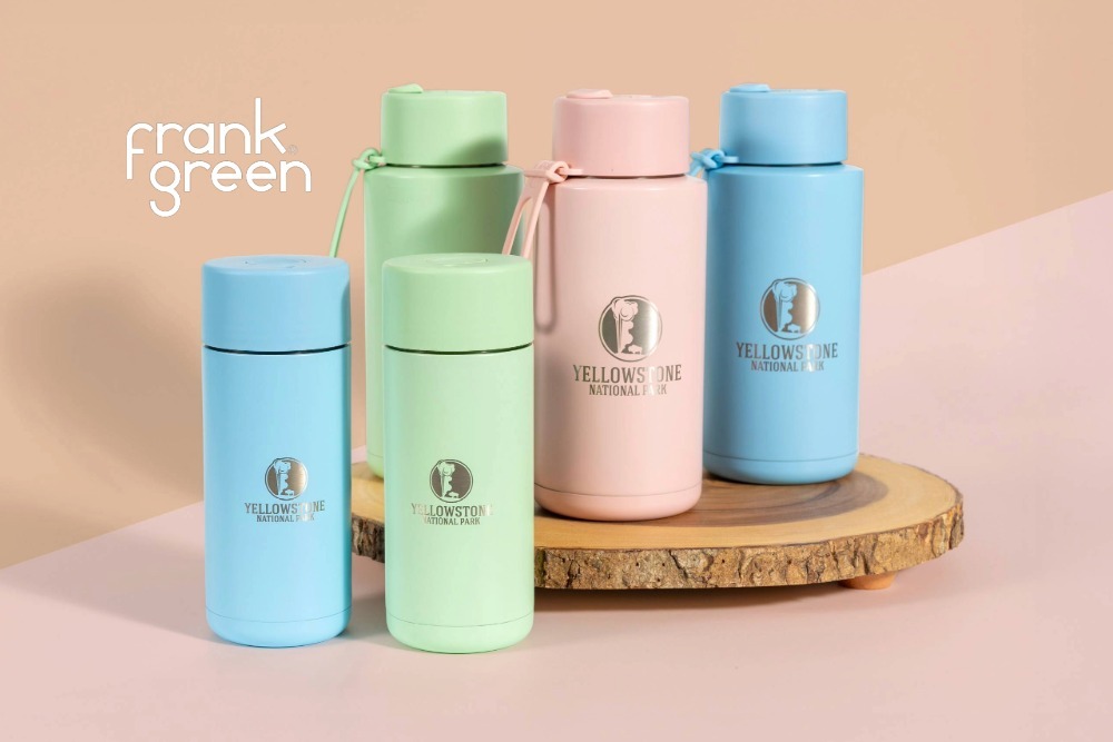 Pink, green, and blue Frank Green reusable water bottles.